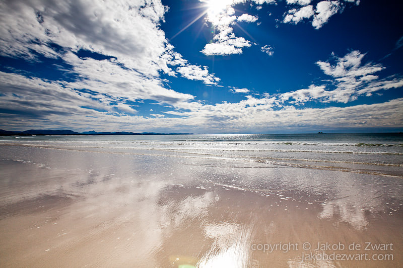 broken head beach looking towards light house